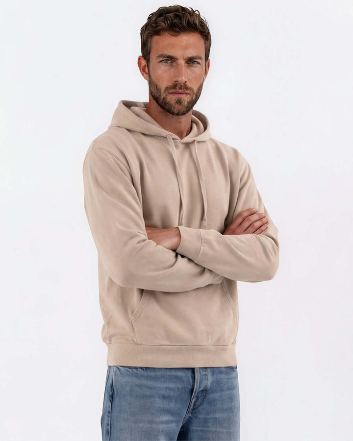 Made in USA vintage pigment dyed fleece pullover hoodie in Khaki with drawstring hood, front pouch pocket, and ribbed cuffs and hem