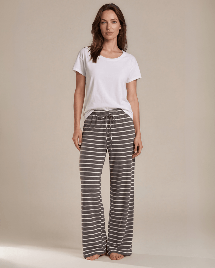 Made in USA. Relax in charcoal striped wide-leg pajama pants with an elastic drawstring waist, side pockets and soft stretch fabric. Sizes S–XL.