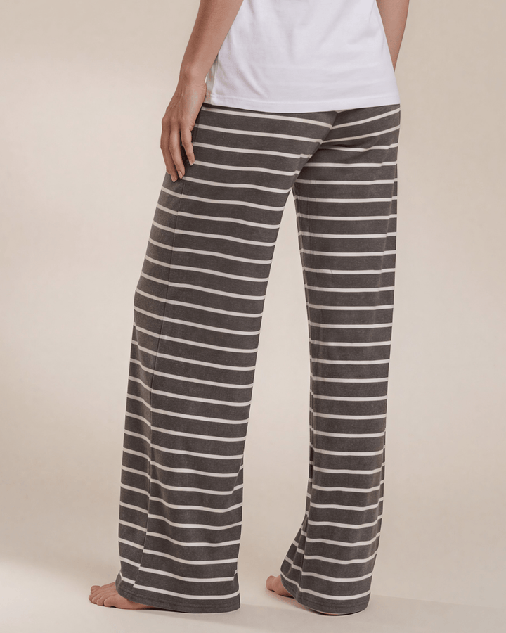 Made in USA. Relax in charcoal striped wide-leg pajama pants with an elastic drawstring waist, side pockets and soft stretch fabric. Sizes S–XL.