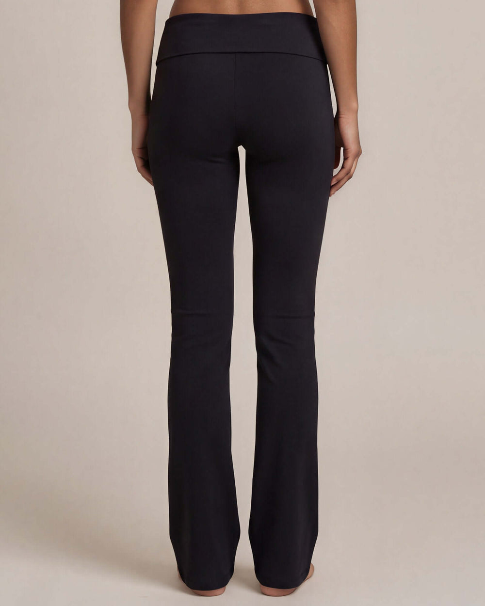 Made in USA women's black cotton spandex yoga pant with wide waistband and slight flare leg, back view