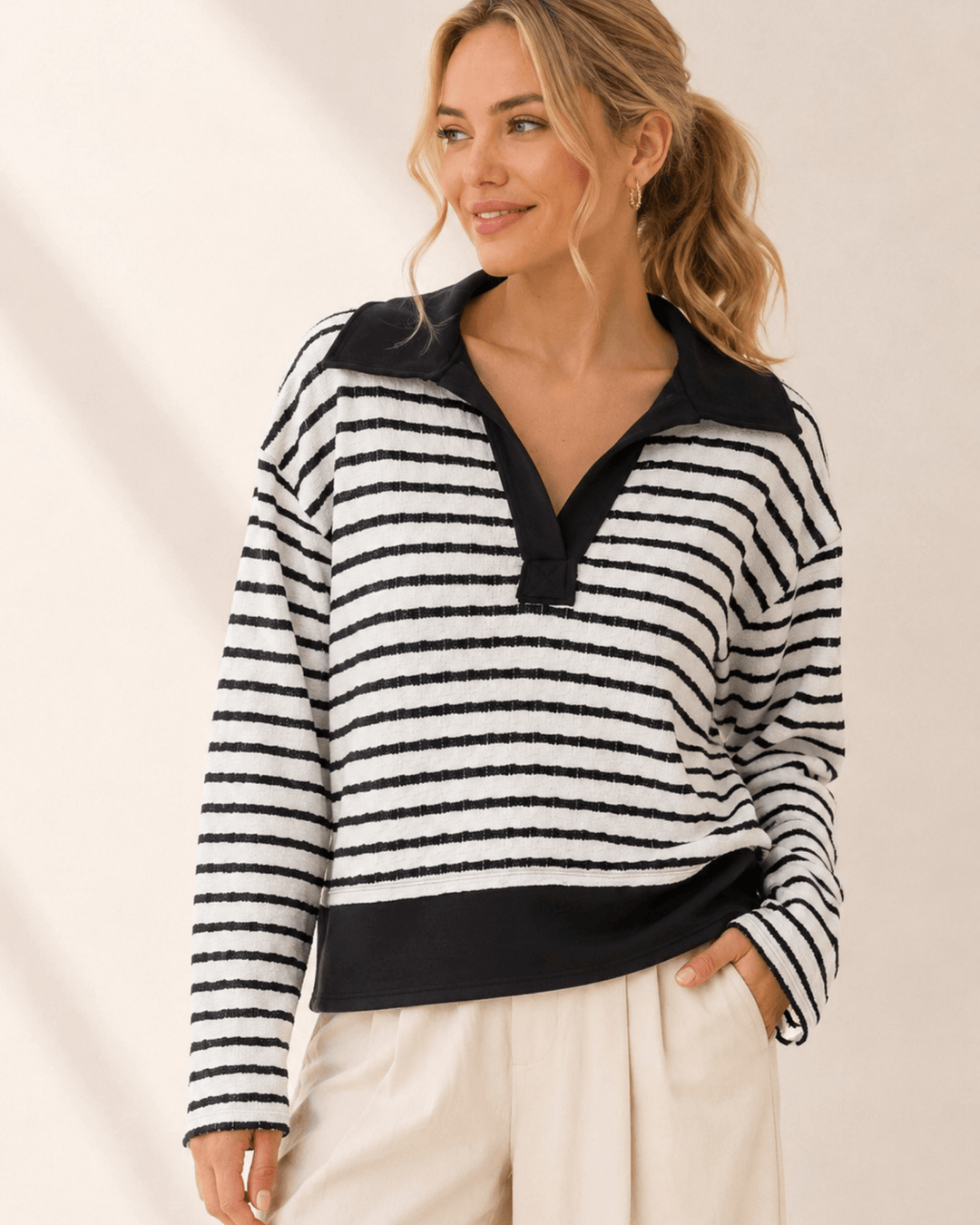 Made in USA. Women's black & white striped polo pullover sweater with contrast collar, open V-neck & solid hem band. Relaxed fit. Sizes S-L.