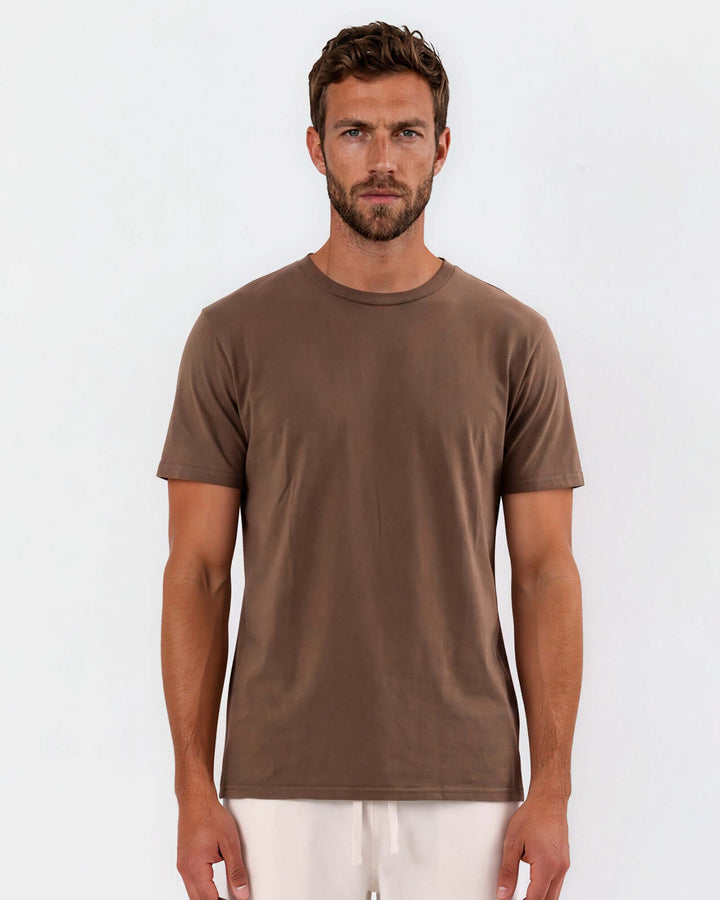 Made in USA Vintage Pigment Dyed Softest Tee - Java: straight-on front view of relaxed brown tee on male model, arms at sides