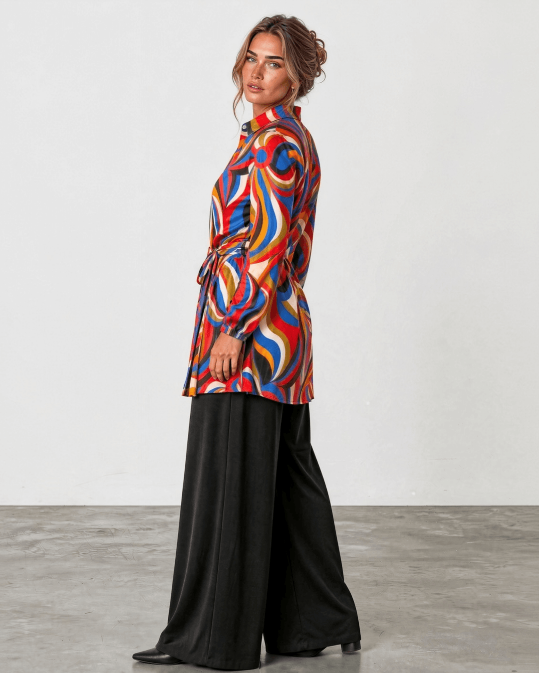 Made in USA. Style the Alexis Retro Print button-down tunic closed with its tie waist or open as a cardigan. Colorful abstract print, fully lined. S–L.