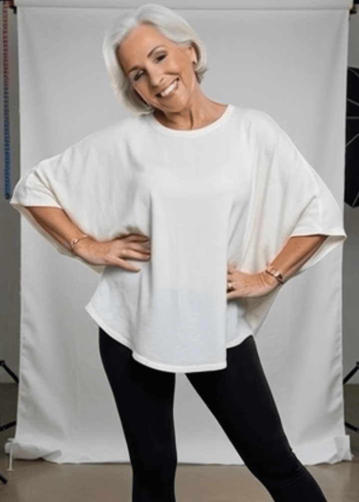 Slip into effortless style with this made in USA oversized dolman sleeve cotton top, designed for maximum comfort without compromise. The soft, lightweight 95% cotton blend with 5% spandex drapes beautifully while moving with you