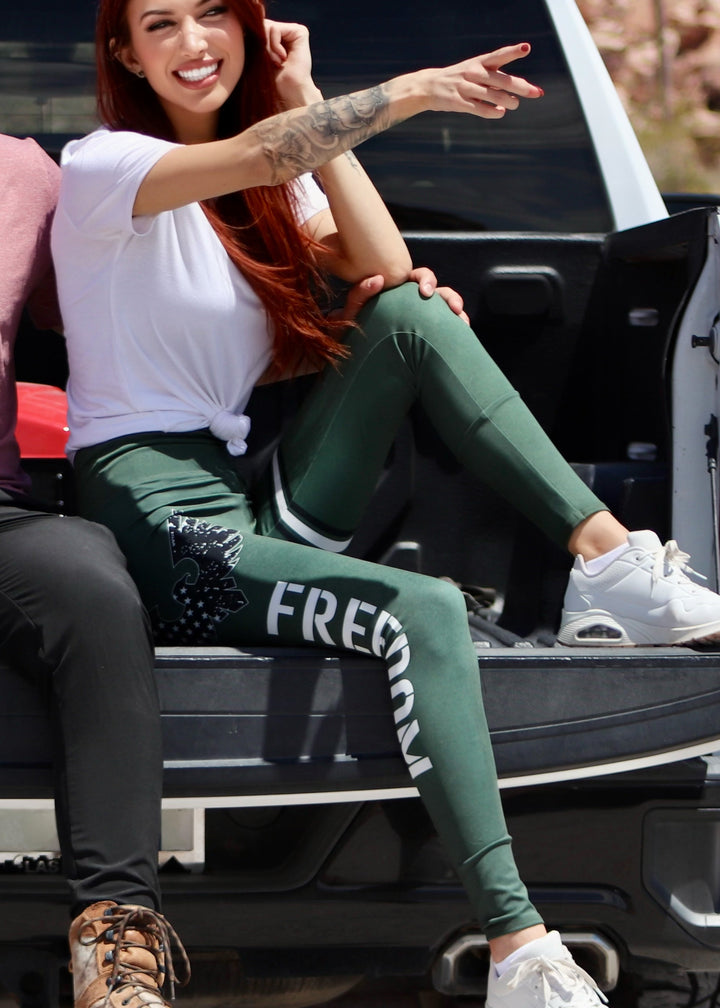 Experience ultimate comfort with the Freedom USA Legging. Crafted with a second skin stretch fabric, it moves effortlessly with you while feeling lightweight and dry against your skin—outperforming cotton in moisture control. The wide waistband with built-in elastic ensures a secure, comfortable fit, while a hidden pocket keeps essentials close. Designed with a contour fit that’s never see-through, these machine-washable leggings are perfect for all-day wear and movement.