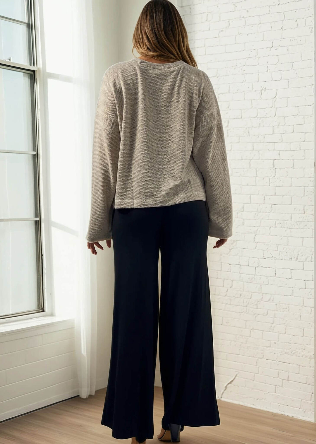 Experience ultimate comfort and style with these Soft Rayon Jersey Palazzo Pants in Solid Black, crafted in the USA. Featuring a flattering fold-over waist and a wide-leg silhouette, they offer a relaxed yet chic look. Made from a stretchy blend of rayon and spandex, these pants move with you while maintaining their softness.