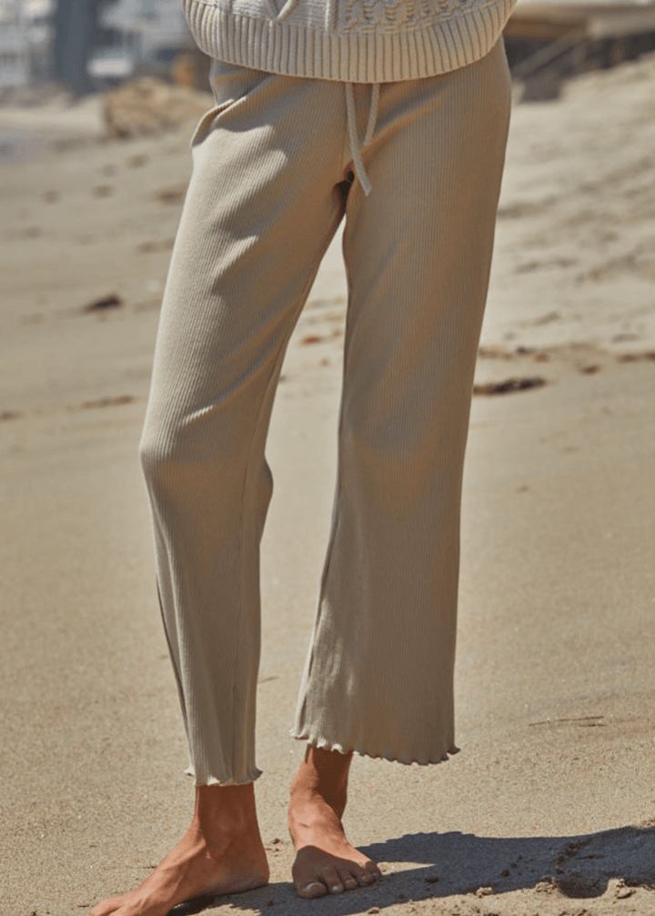 Elevate your everyday wardrobe with these Ribbed Knit Lettuce Hem Pants, designed for effortless comfort and timeless style. Crafted from a luxurious blend of 95% cotton and 5% spandex - Made in USA
