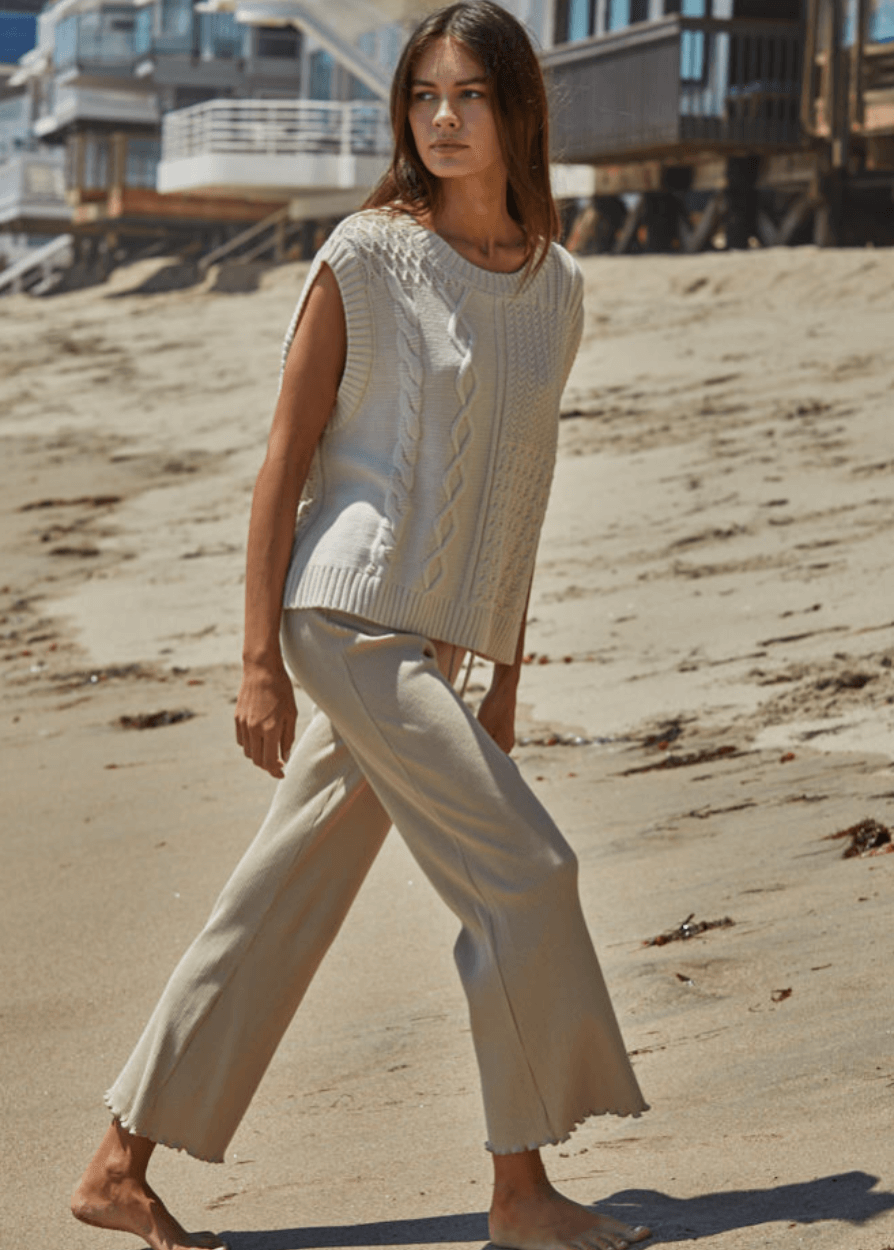 Elevate your everyday wardrobe with these Ribbed Knit Lettuce Hem Pants, designed for effortless comfort and timeless style. Crafted from a luxurious blend of 95% cotton and 5% spandex - Made in USA