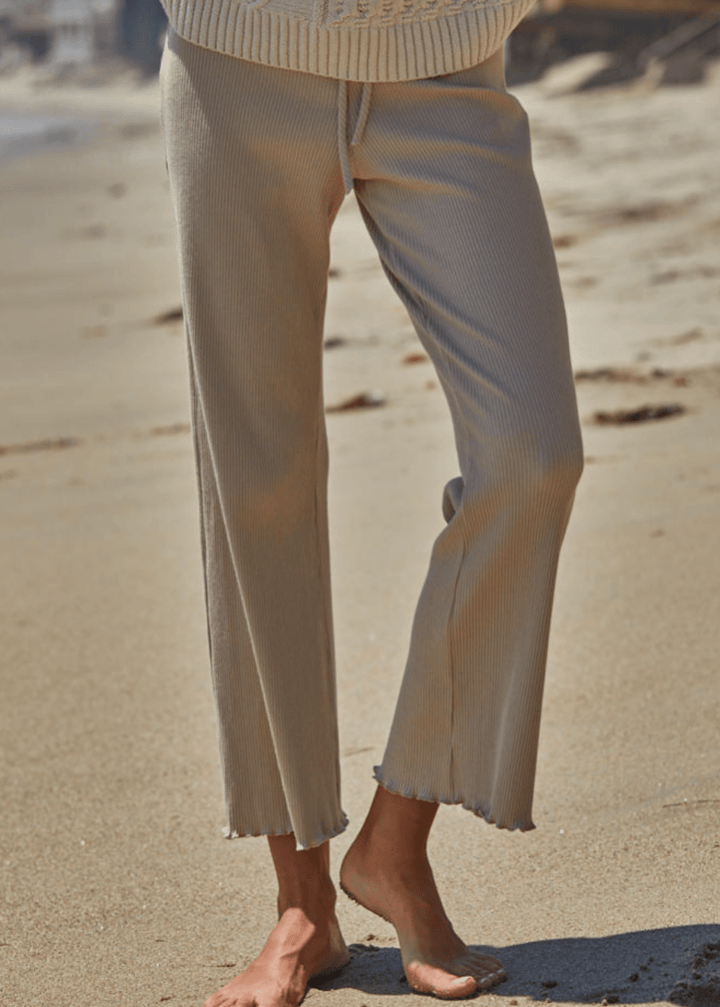 Elevate your everyday wardrobe with these Ribbed Knit Lettuce Hem Pants, designed for effortless comfort and timeless style. Crafted from a luxurious blend of 95% cotton and 5% spandex - Made in USA