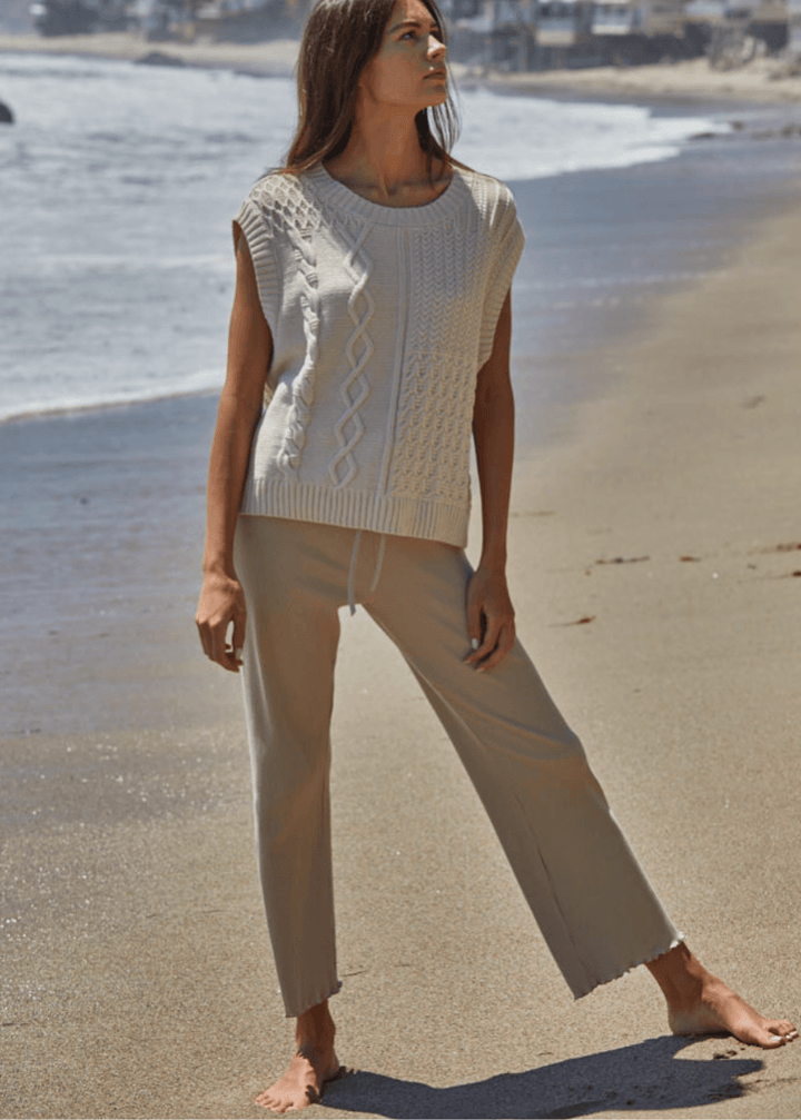 Elevate your everyday wardrobe with these Ribbed Knit Lettuce Hem Pants, designed for effortless comfort and timeless style. Crafted from a luxurious blend of 95% cotton and 5% spandex - Made in USA
