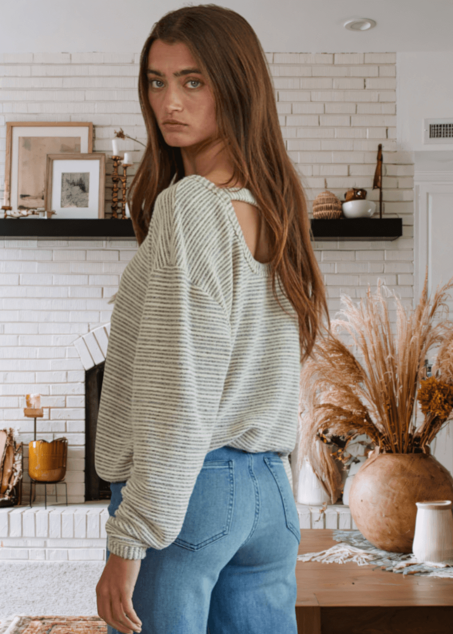Embrace effortless comfort with the Cara Pullover, a soft and cozy sweater designed for everyday wear. Featuring a relaxed loose fit and round neckline, this just-below-waist-length top transitions seamlessly from casual to polished.  This Made in USA Ivory and Gray sweater is perfect for layering or wearing solo.