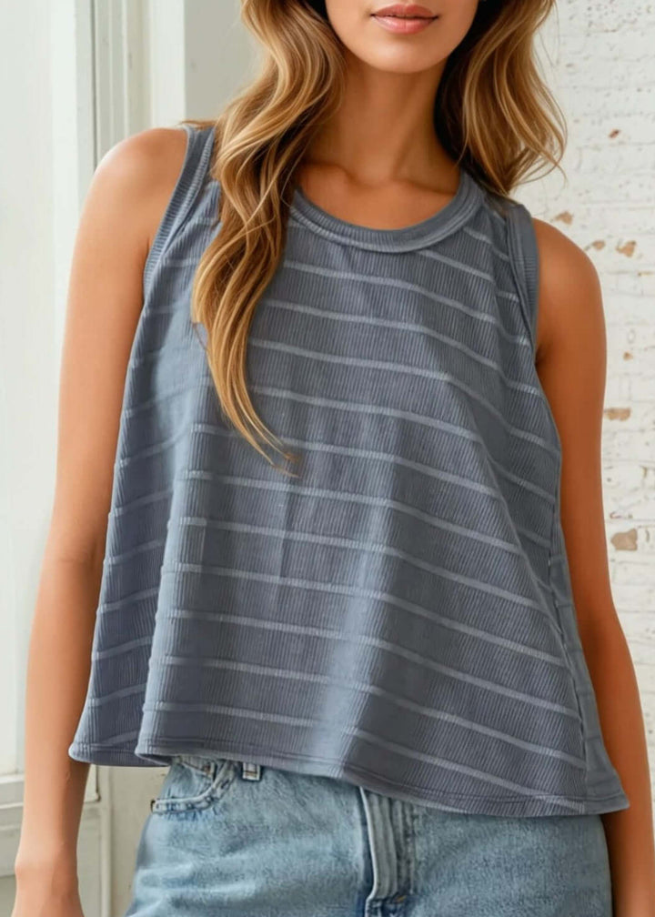 Meet your new go-to for relaxed comfort. This Made in USA striped tank top pairs casual ease with understated style—perfect for lazy mornings, weekend errands, or evenings at home. 