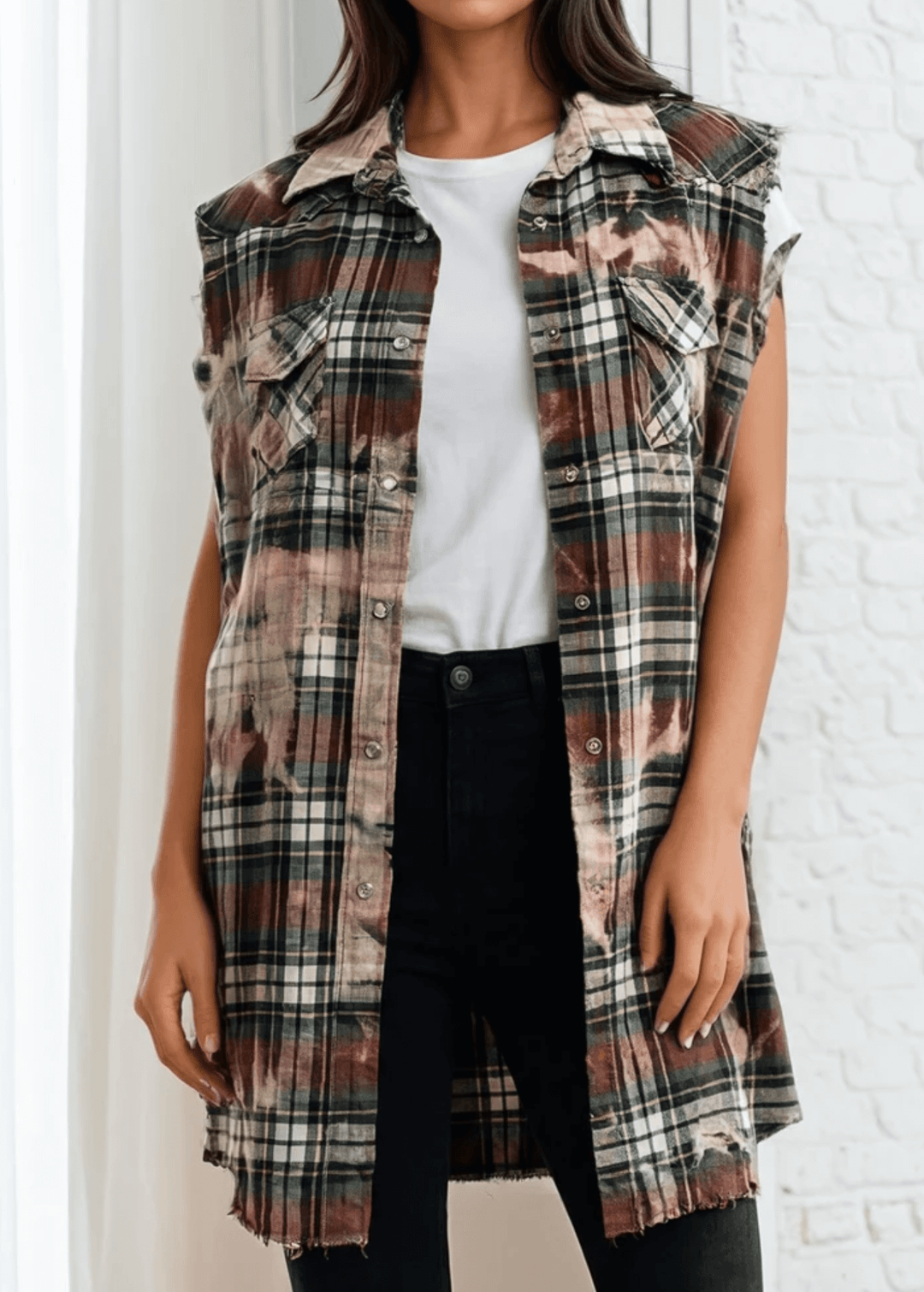 Meet The Sedona Sunset Sleeveless Plaid Flannel Tunic - a sleeveless, boho-chic essential designed for effortless layering and laid-back luxury. Crafted in Los Angeles from ultra-soft, vintage-washed plaid, this one-of-a-kind piece features hand-bleached details, raw frayed edges, and classic chest pockets for a relaxed yet elevated vibe. Its tunic length makes it versatile enough to wear open over denim shorts or buttoned up as a dress.