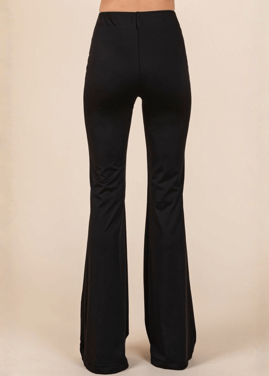 Enjoy everyday comfort with these Stretchy Soft Flare Black Athleisure Pants. Designed in USA with a high-rise silhouette and flared hem, they deliver a flattering, versatile look that transitions seamlessly from studio to street. 