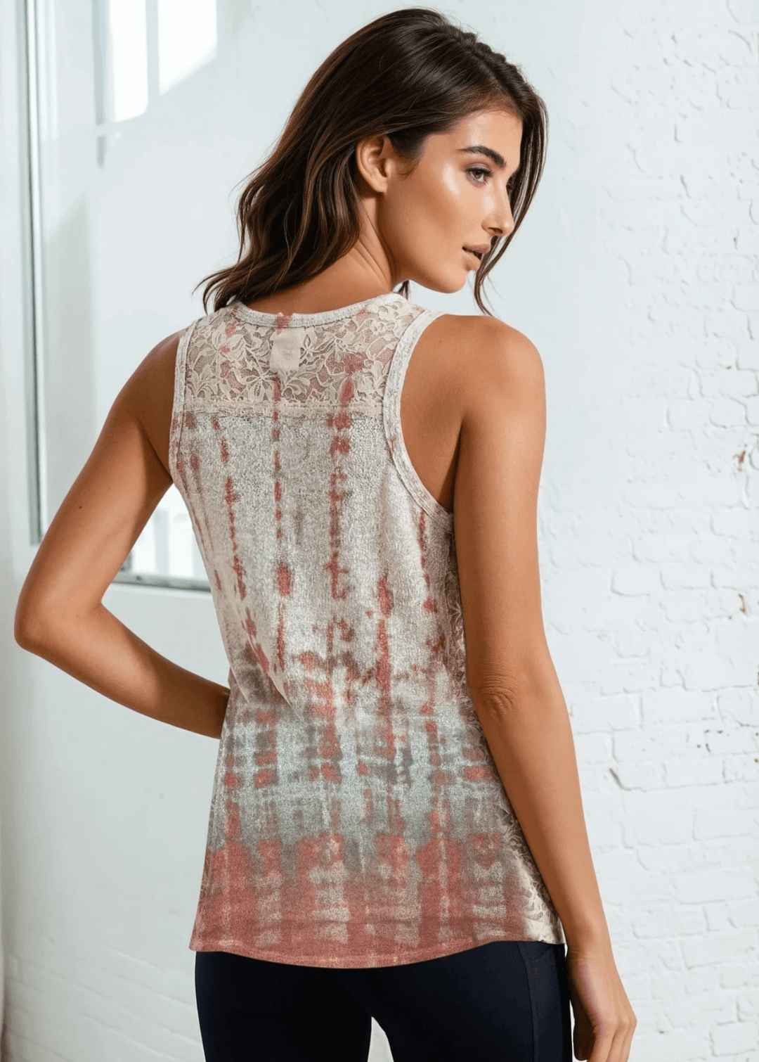 Effortlessly chic and versatile, the Tara Tie Dye Sublimation Tank Top brings vibrant color and texture to your casual wardrobe. This sleeveless design features a flattering V-neckline and delicate side lace detailing that adds dimension without bulk. Made in USA