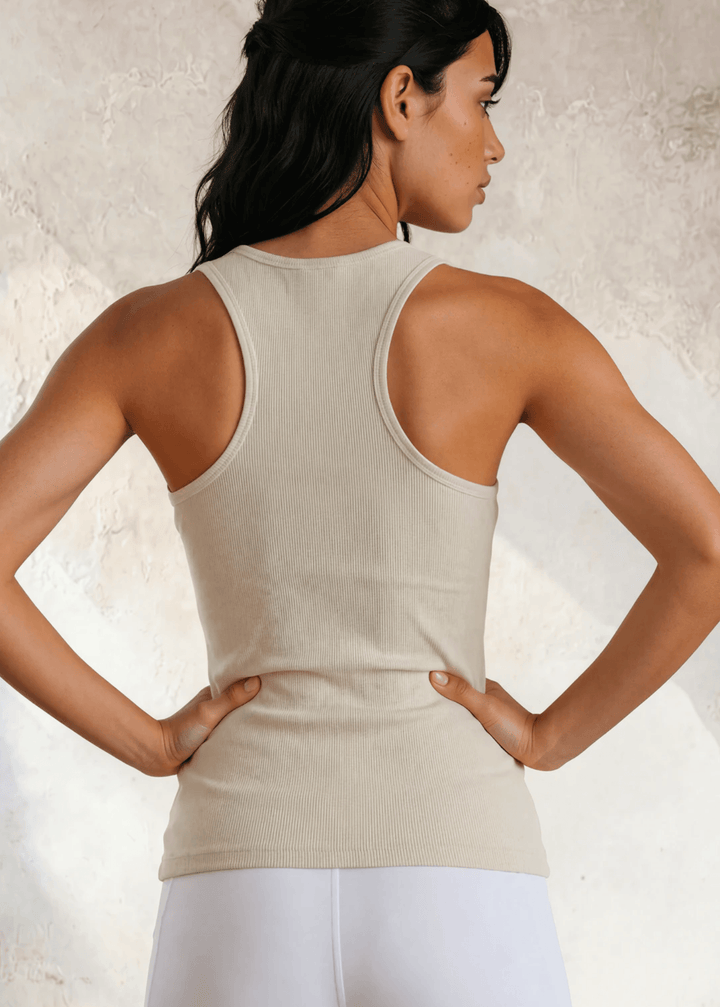 The Bra30 Tummy Tucker is an extra-long extra supportive racerback tank top that comfortably helps smooth out those unwanted lumps and bumps.  Egg Nog Cream Color , Made in USA