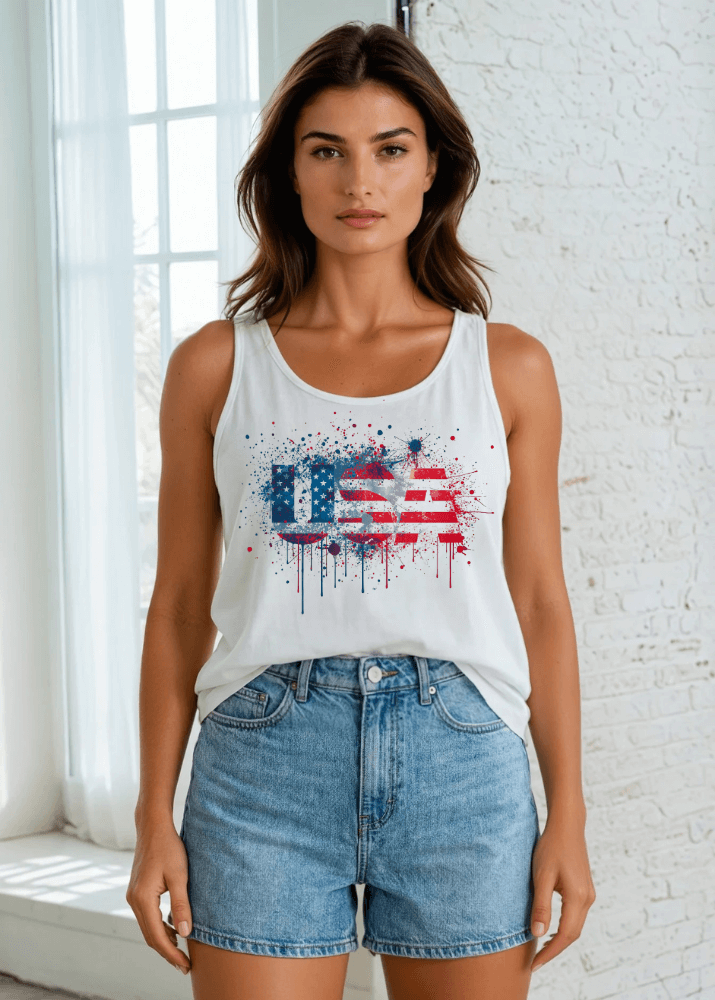 Celebrate your patriotic spirit in this eye-catching Paint Splatter USA American Flag Tank. Crafted from soft, breathable 95% cotton and 5% spandex blend.  Made right here in the USA with American cotton, this versatile tank delivers comfort and style with every wear