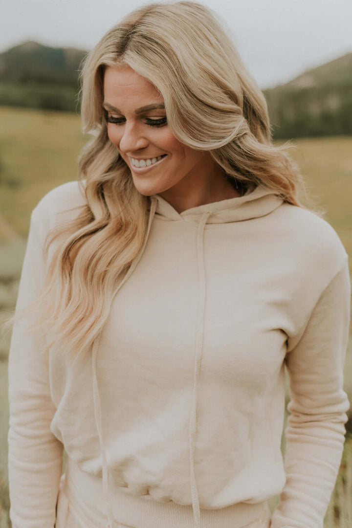 This vintage inspired cropped hoodie is made from light-weight 100% organic cotton. Wear this on a cozy coffee date on an overcast day or a movie night in with friends.  100% Organic Cotton Made in USA