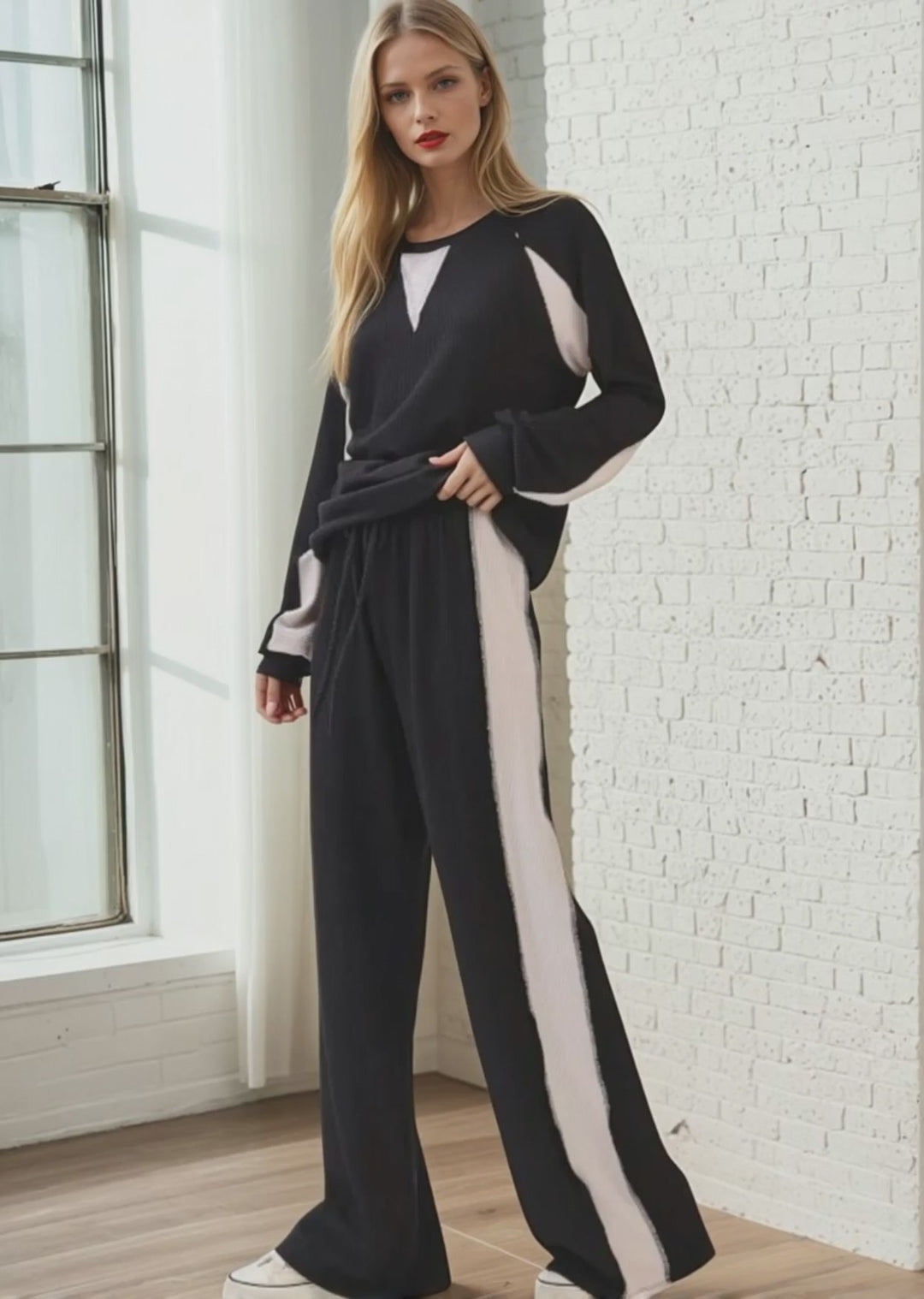 Experience effortless style and comfort with the Hailey Rib Knit Color Block Pullover (Style TL2053) with matching lounge pant (PA1145). Crafted in the USA from a soft, stretchy fabric, Black with Cream contrast
